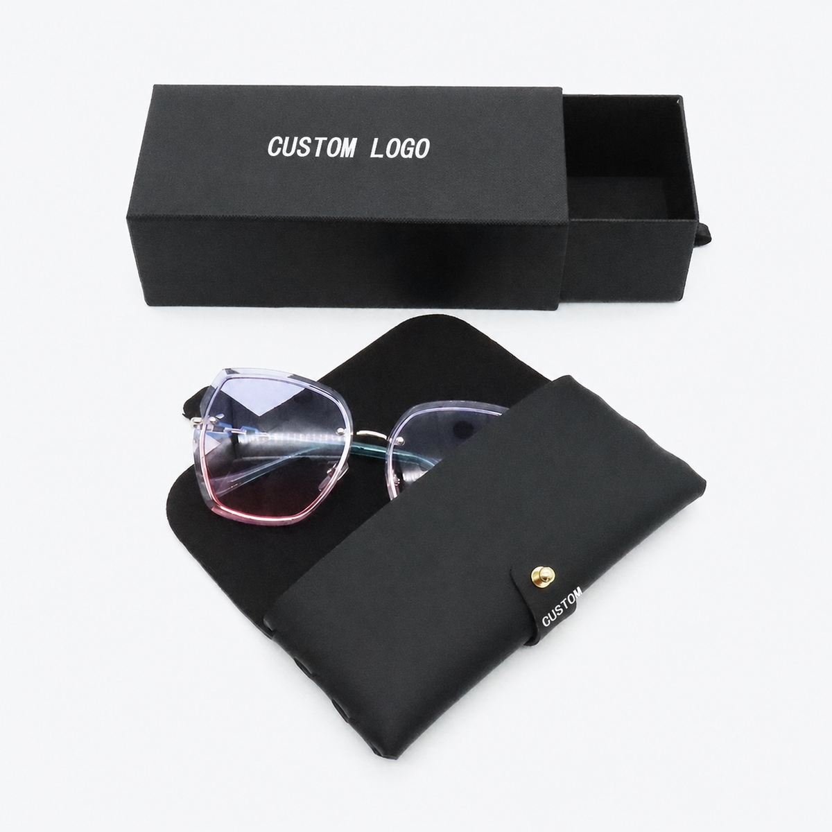 Black roll-up eyewear case shown open beside a black drawer-style box