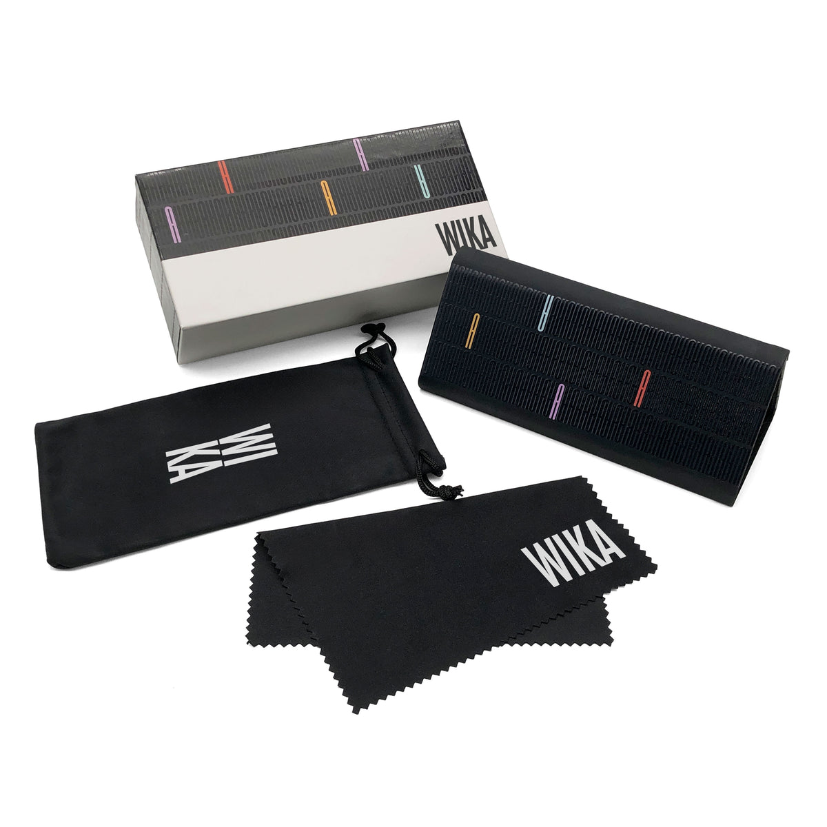 Graphic case and printed box beside pouch and cloth
