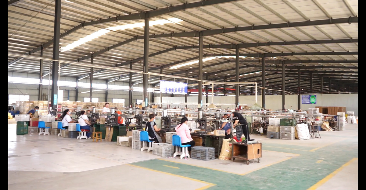 WIKA workshop interior with production workstations and staff